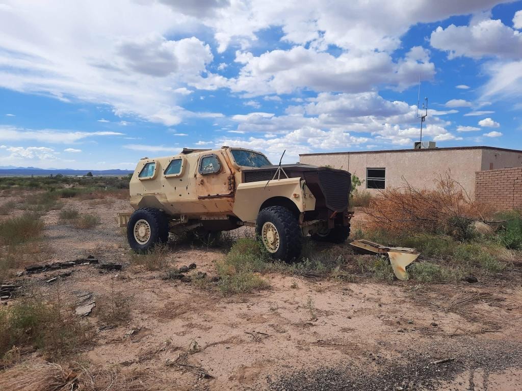 Tan armored military vehicle prop at American Milsim Copperhead XI event field