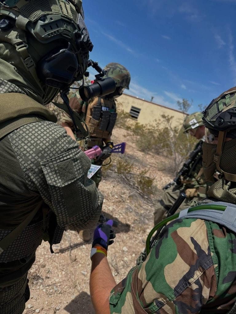 Players in tactical gear during field action at American Milsim Copperhead XI