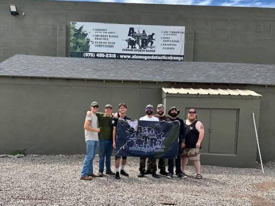 ATR team group photo outside the facility holding the ATR banner before American Milsim Copperhead XI