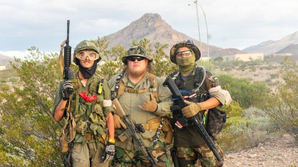 Three players in full tactical gear in the desert at American Milsim Copperhead XI