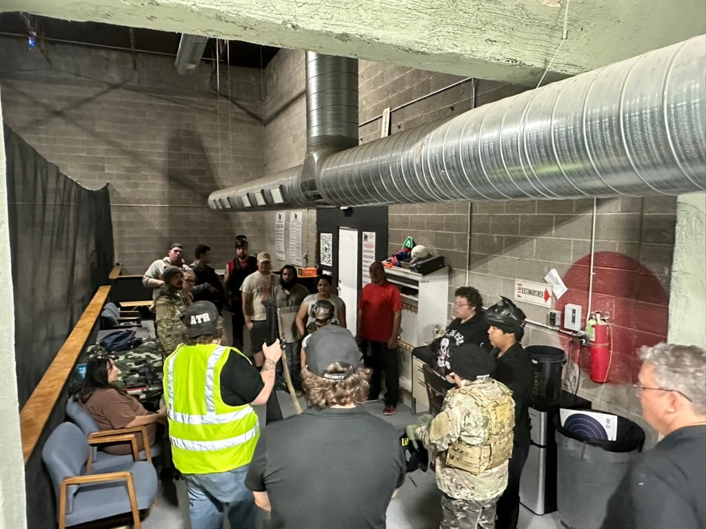 Players gathered in the staging hallway for a pre-game briefing at ATR