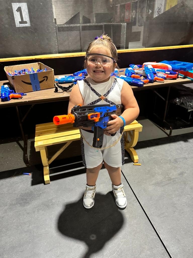 Kids celebrating at Malia's Nerf birthday party at Alamogordo Tactical Range