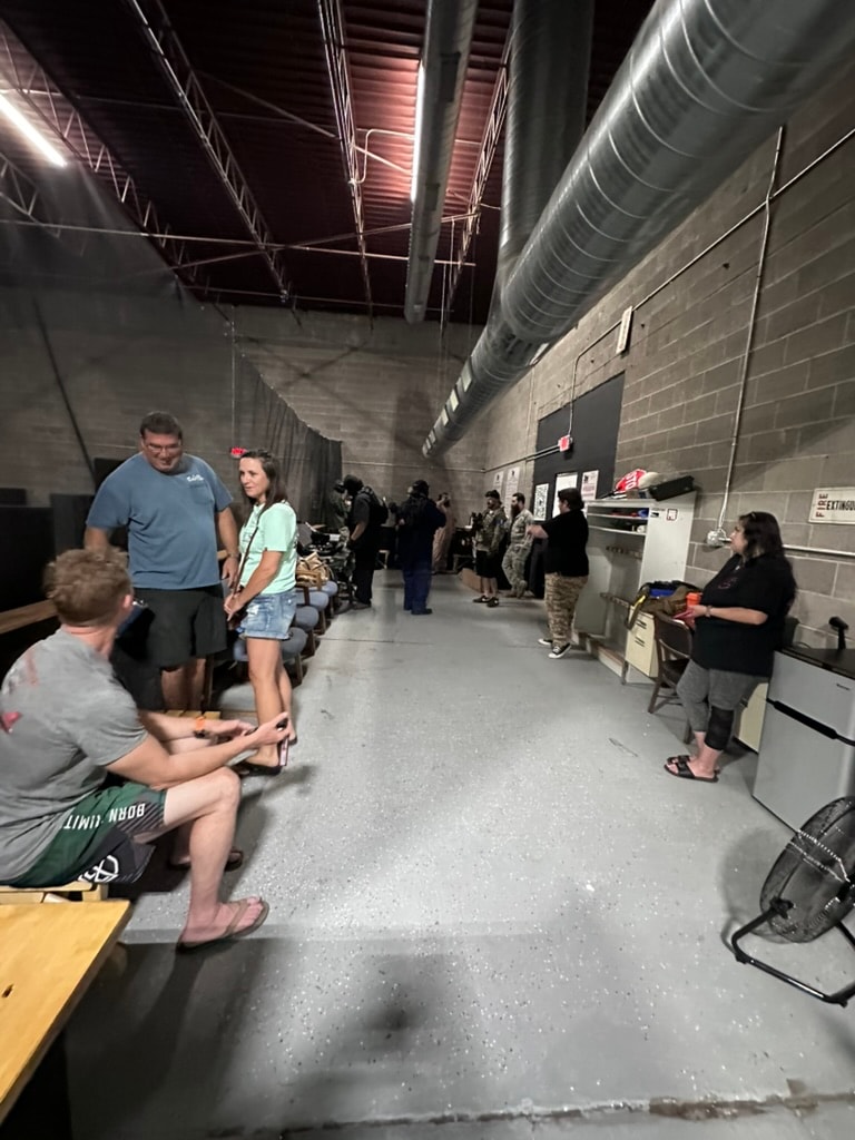 Spectators and players gathered in the staging area at Alamogordo Tactical Range